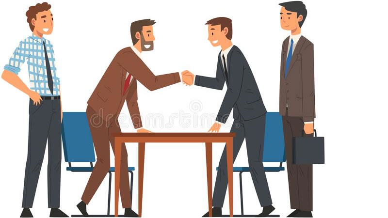 Business professionals closing a deal in a meeting