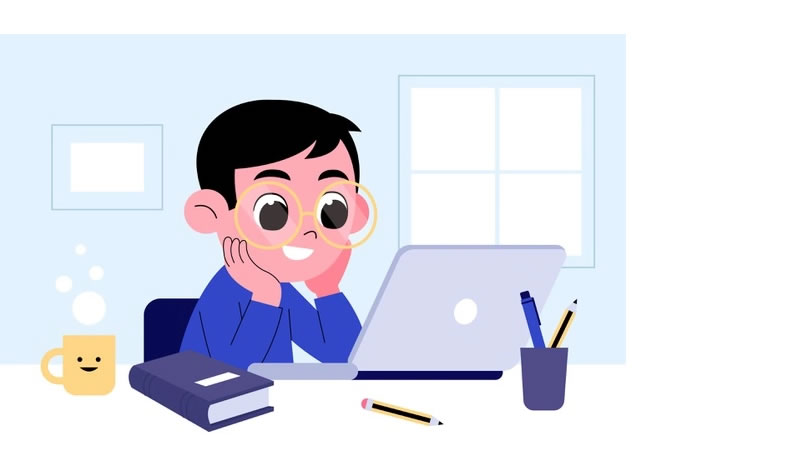 Student learning at a desk with laptop and books